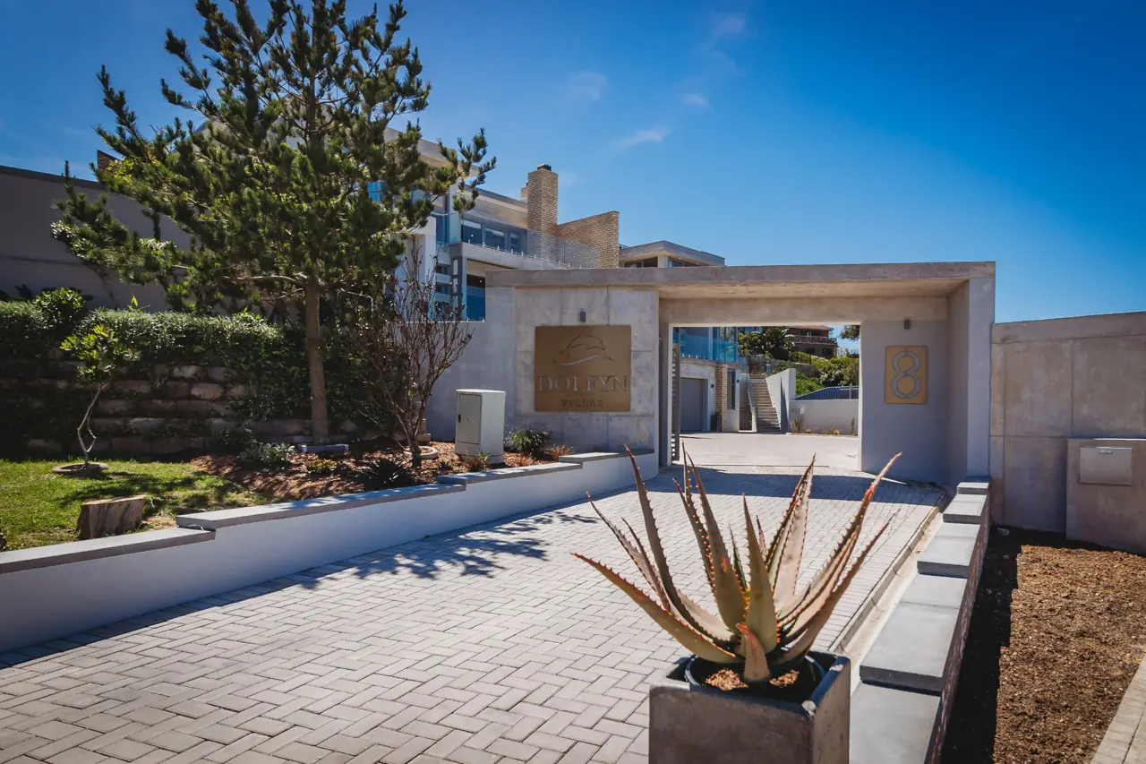 Dolfyn Villas exterior and shared parking courtyard