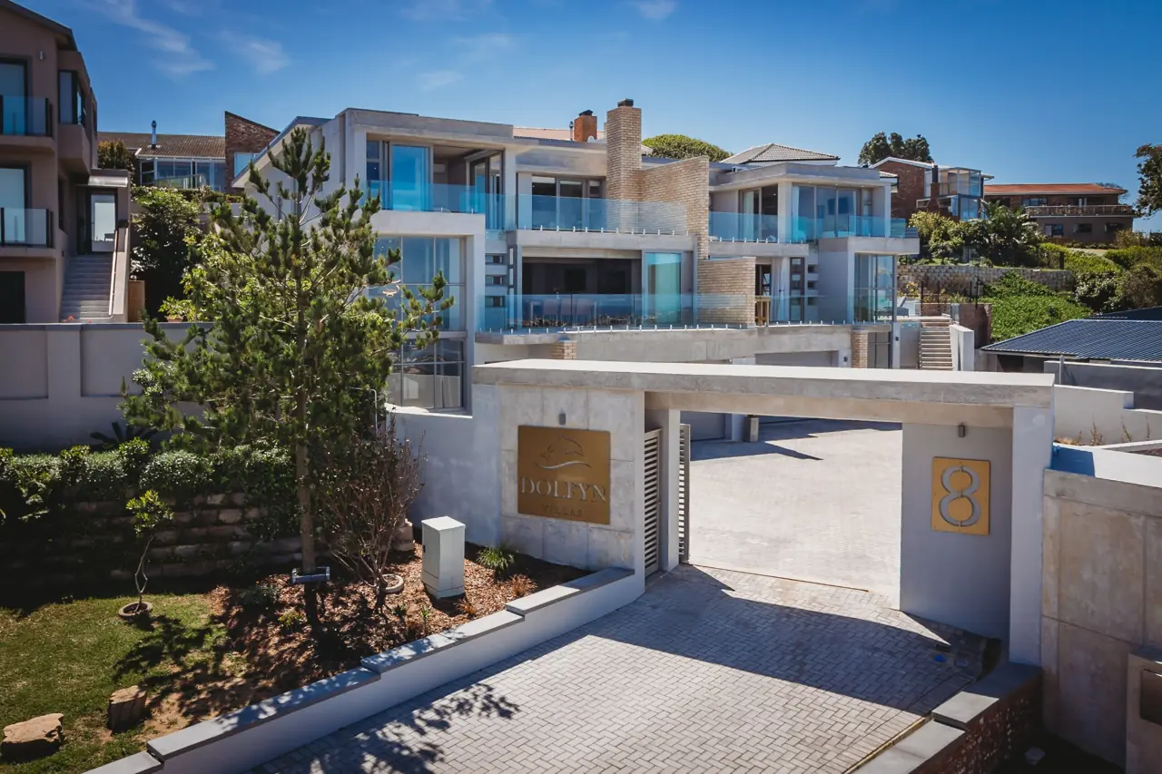 Dolfyn Villas exterior and shared parking courtyard