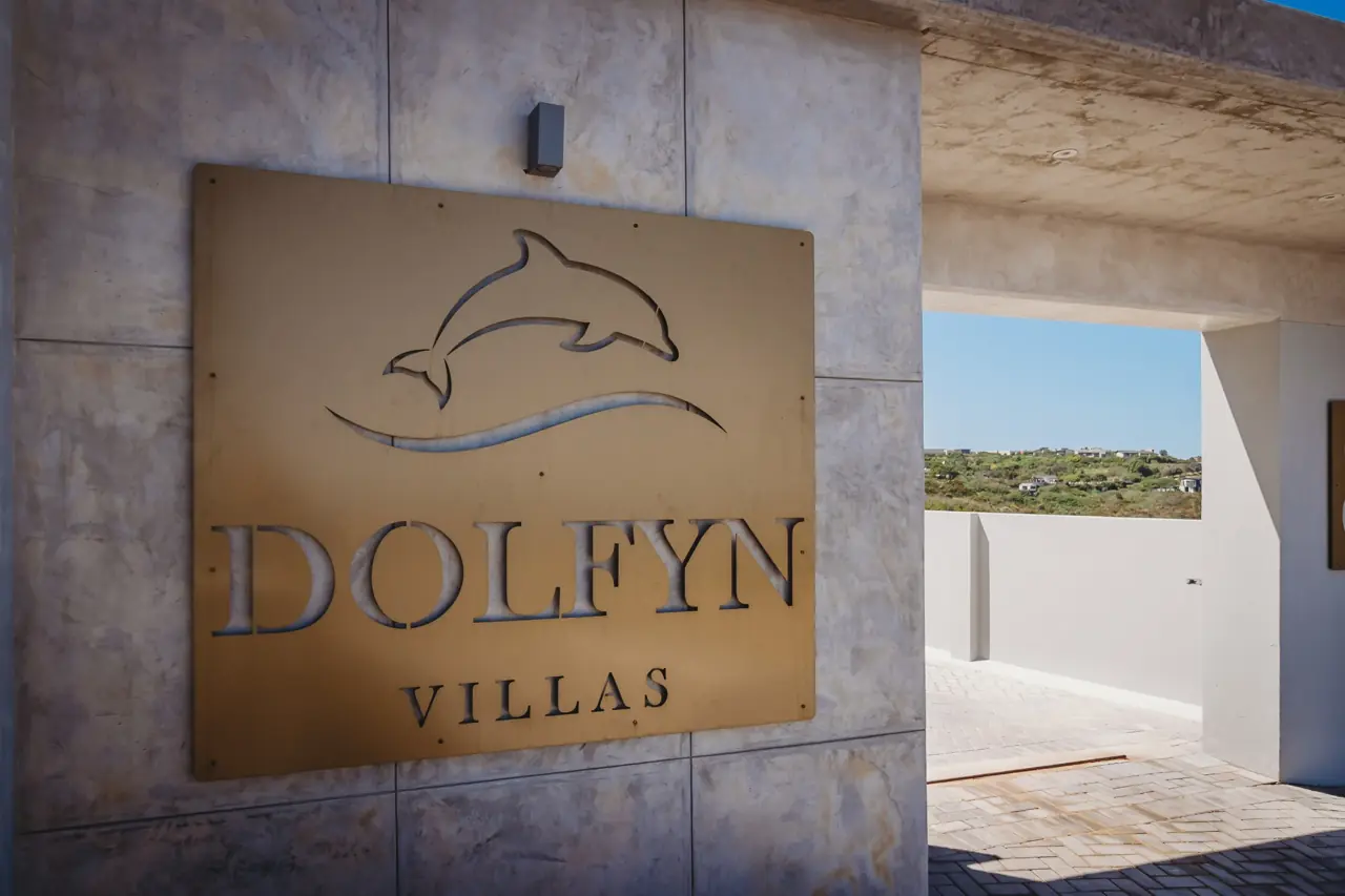 Dolfyn Villas exterior and shared parking courtyard