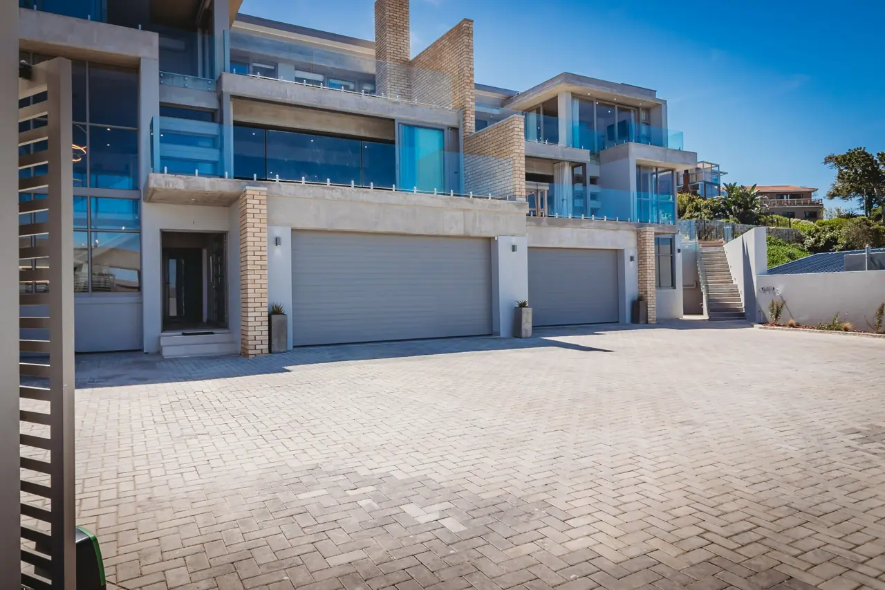 Dolfyn Villas exterior and shared parking courtyard
