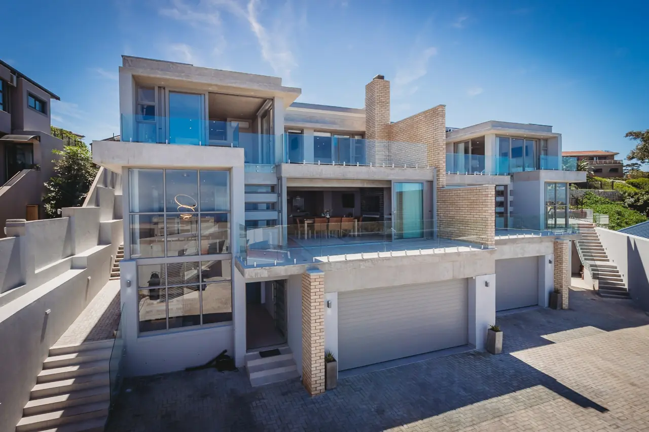 Dolfyn Villas exterior and shared parking courtyard
