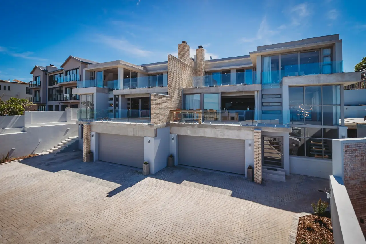 Dolfyn Villas exterior and shared parking courtyard