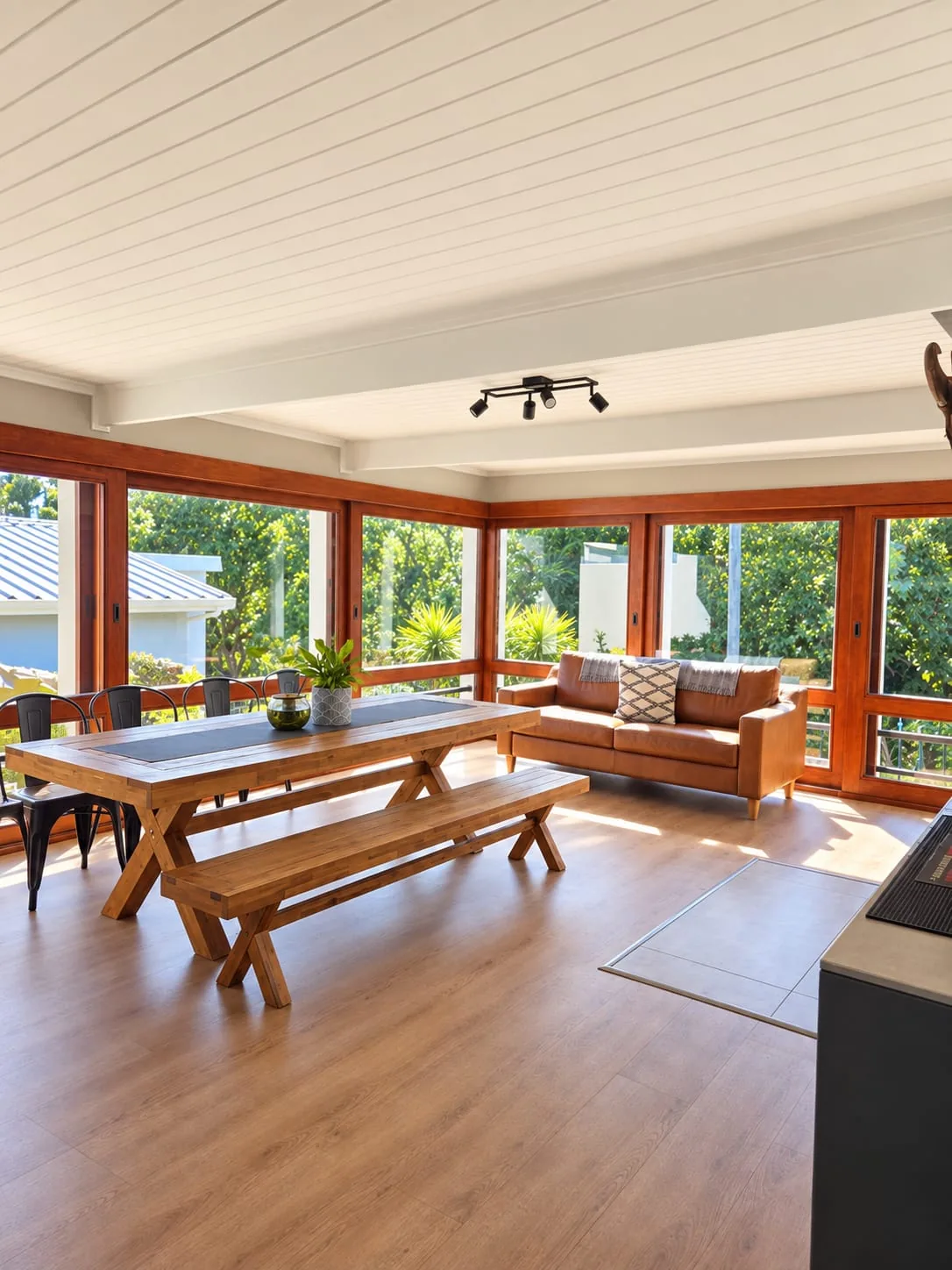 The Mountain House — Sunlit indoor entertainment and braai room